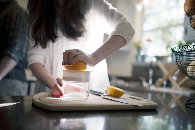 ninja juicer guide - Person juicing an orange in a kitchen (Fieldnotes)